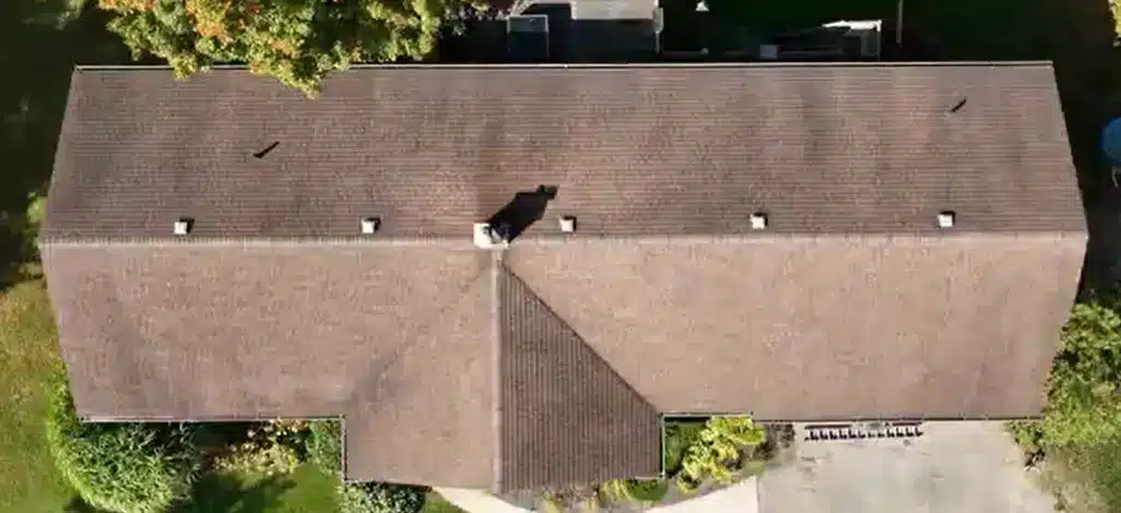 Red shingle roof house in Baden, Ontario, surrounded by trees and a driveway, seen from above.