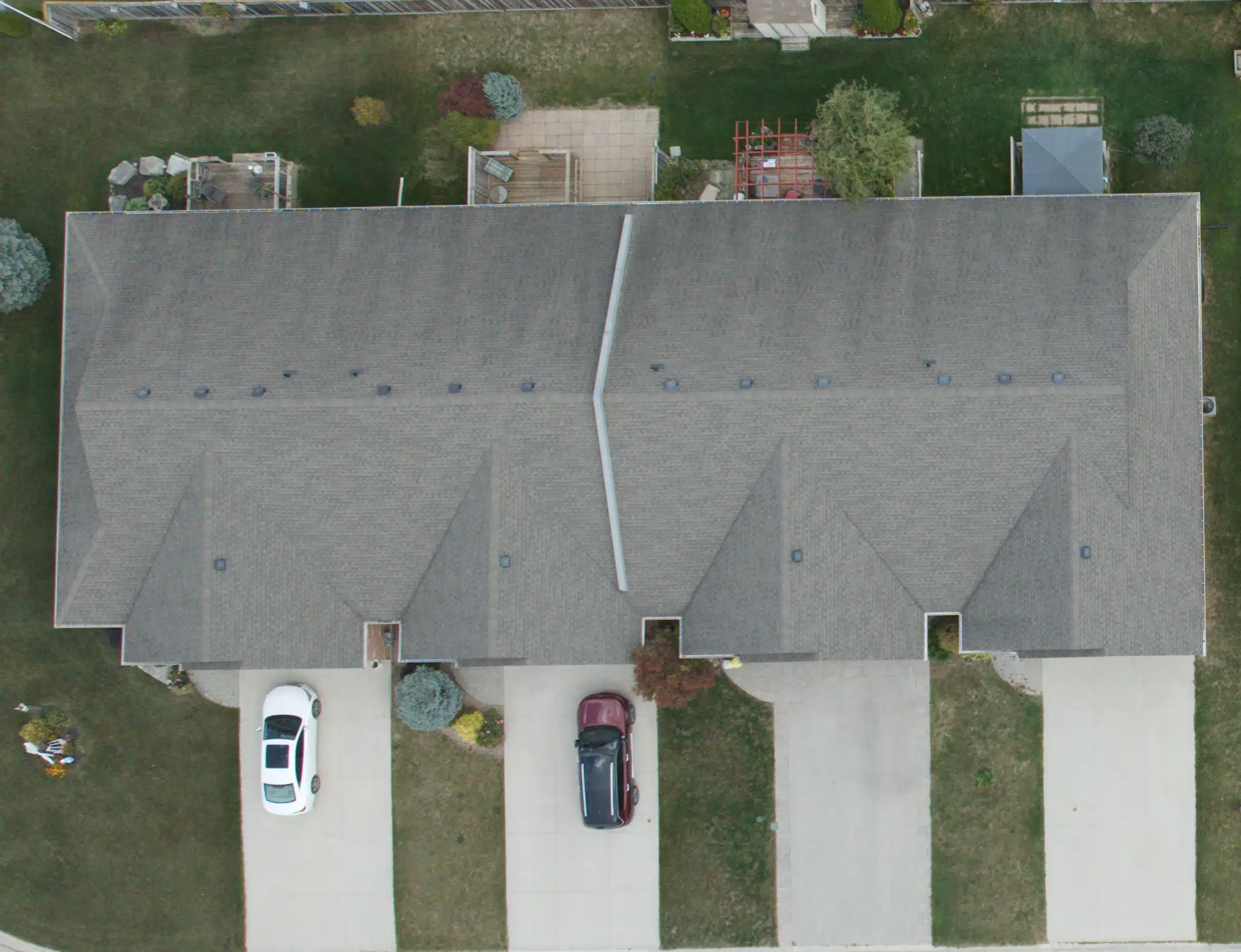 New Project (8) Victoria BC duplex from above with two parked cars and visible backyards.